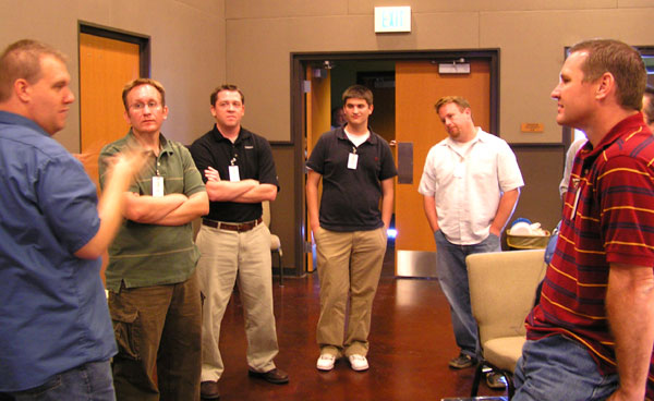 A group gather to discuss various things during one of the breaks A group gather to discuss various things during one of the breaks